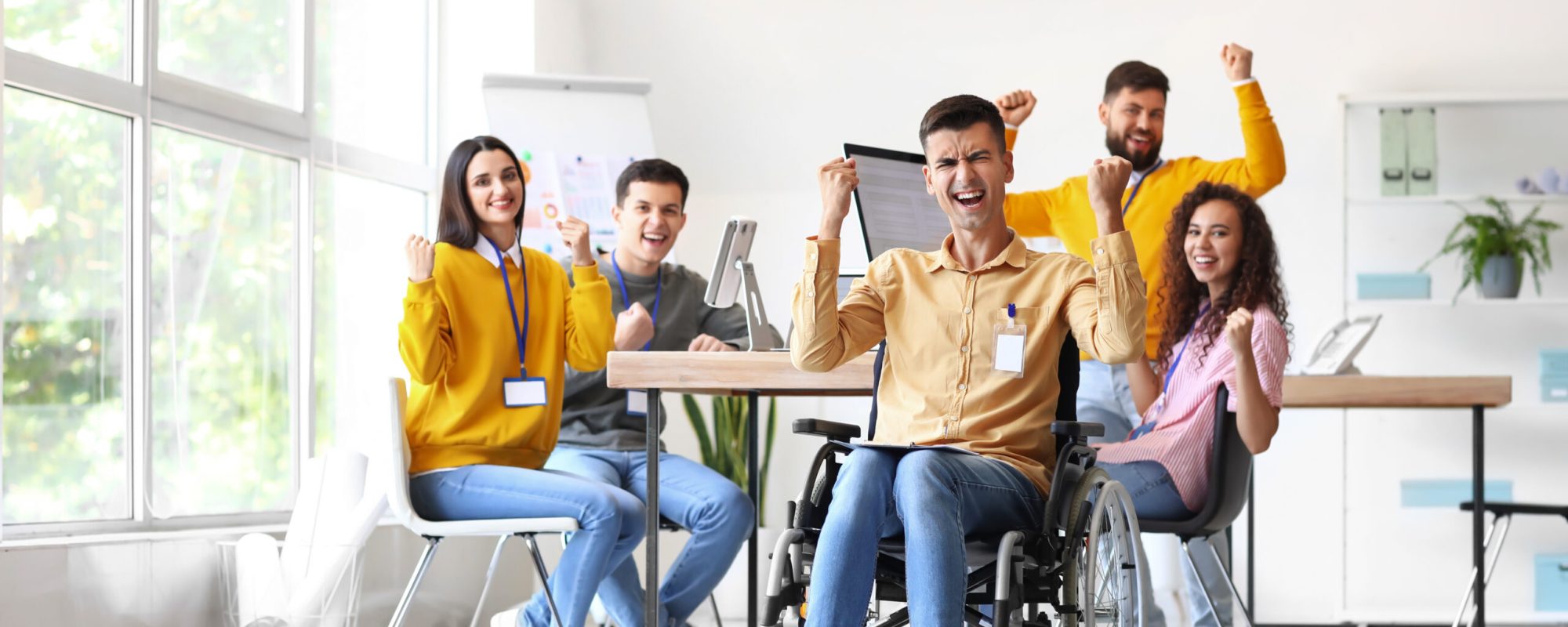 Happy young business people working in office
