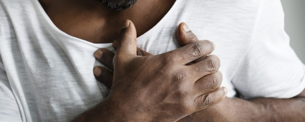 Black man having a heart attack