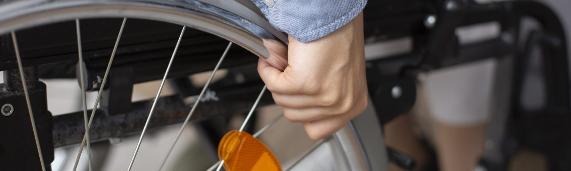 close-up-hand-holding-wheel