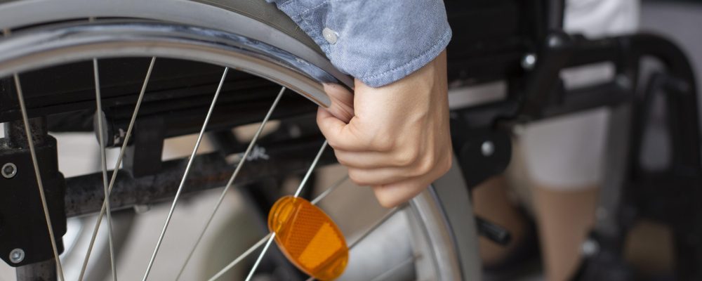 close-up-hand-holding-wheel