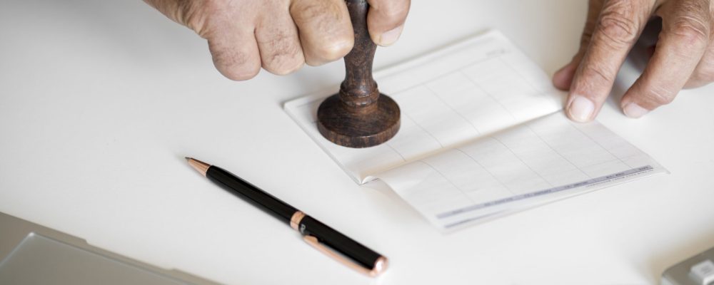 People checking bankbook isolated on white table