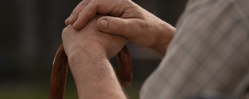 side-view-old-man-sitting-bench